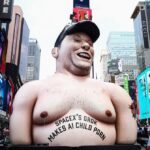 Times Square Erupts: Giant Elon Musk Effigy Protests Grok's AI Controversies Amidst SpaceX IPO Hype 2 Inflatable effigy of Elon Musk in Times Square during a protest against Grok AI and SpaceX IPO.