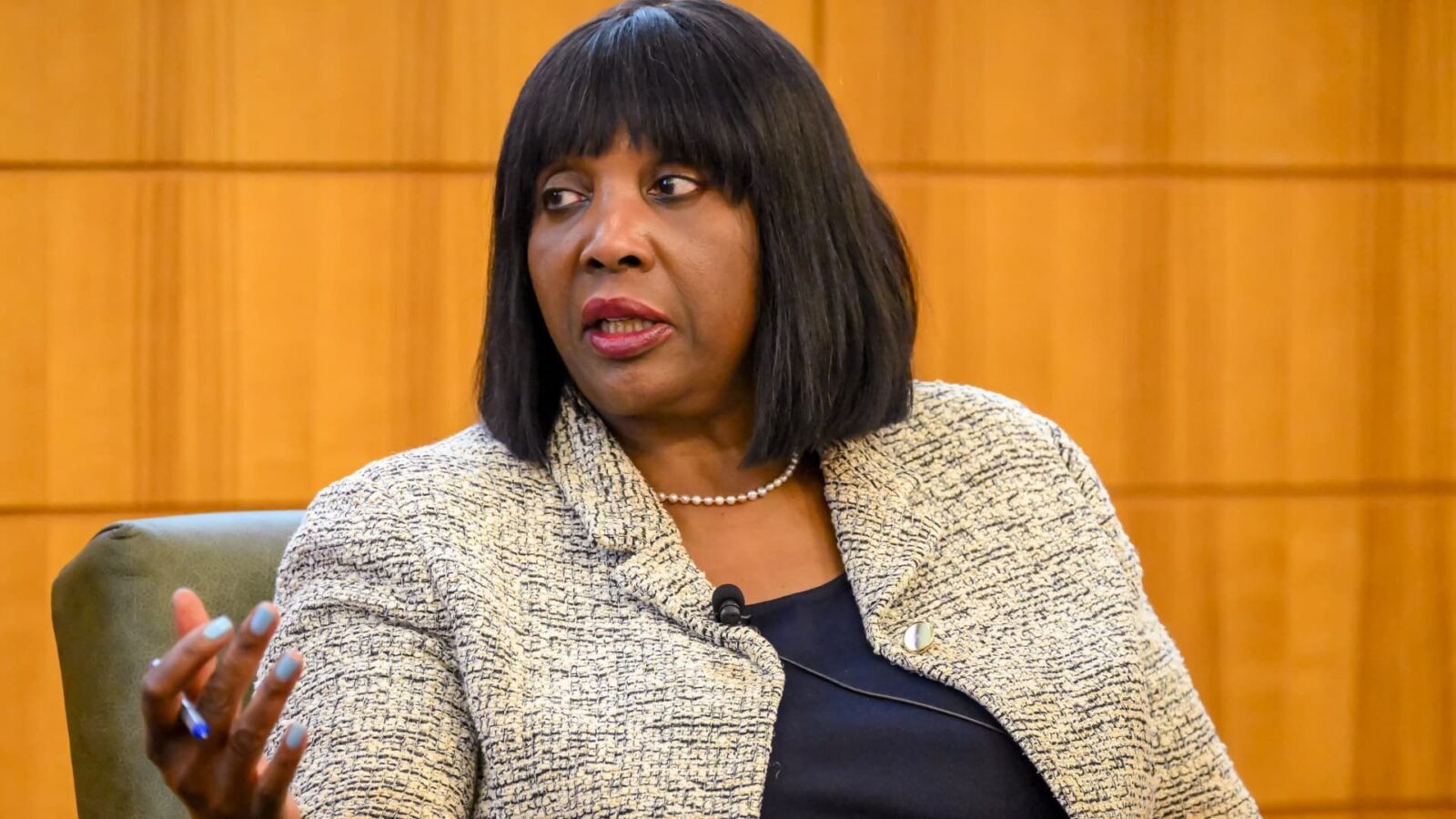Federal Reserve Board Governor Lisa Cook speaking at an event.