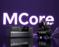 Gweike MCore dual-laser cutter processing metal and non-metal materials in a workshop setting