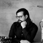 Experimental musician and YouTuber Hainbach in his studio, surrounded by unique synthesis equipment.