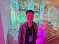 James Wo, CEO and founder of DFG, speaking at a crypto conference about crypto investments.
