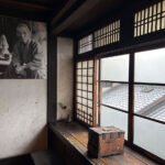 A traditional Japanese machiya townhouse in Kyoto, home and studio of folk potter Kawai Kanjirō, with dark wood and a kawara roof.