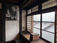 A traditional Japanese machiya townhouse in Kyoto, home and studio of folk potter Kawai Kanjirō, with dark wood and a kawara roof.