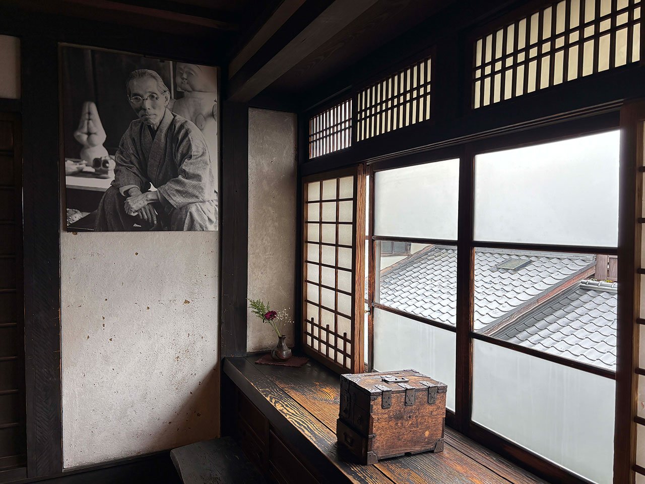 A traditional Japanese machiya townhouse in Kyoto, home and studio of folk potter Kawai Kanjirō, with dark wood and a kawara roof.