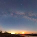 Cosmic Enigma Solved: Astronomers Pinpoint Source of Mysterious Repeating Radio Bursts 8 Artistic representation of a white dwarf and a red dwarf in a close binary system, with radio signals and X-ray emissions emanating from their interaction.