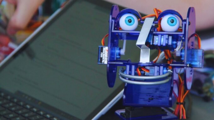 Attendees interacting with exhibits at Maker Faire Long Island, showcasing various DIY and technology projects.