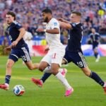Les joueurs de l'équipe nationale marocaine de football, les Lions de l'Atlas, célèbrent un but lors du match de la Coupe du monde 2026 contre l'Écosse, symbolisant leur performance historique.
