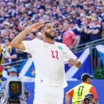 Les Lions de l'Atlas célèbrent leur victoire contre l'Écosse lors du Mondial 2026, prenant la tête du groupe C.