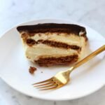 Effortless Indulgence: The Ultimate No-Bake Chocolate Eclair Cake 6 A delicious no-bake chocolate eclair cake with layers of graham crackers, creamy filling, and a rich chocolate ganache topping