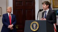 Sam Altman, CEO of OpenAI, in discussion with Washington policymakers, symbolizing the intersection of government and advanced AI technology.
