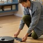 A Roborock robot vacuum cleaner with a self-emptying dock, showcasing Prime Day deals.