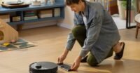 A Roborock robot vacuum cleaner with a self-emptying dock, showcasing Prime Day deals.
