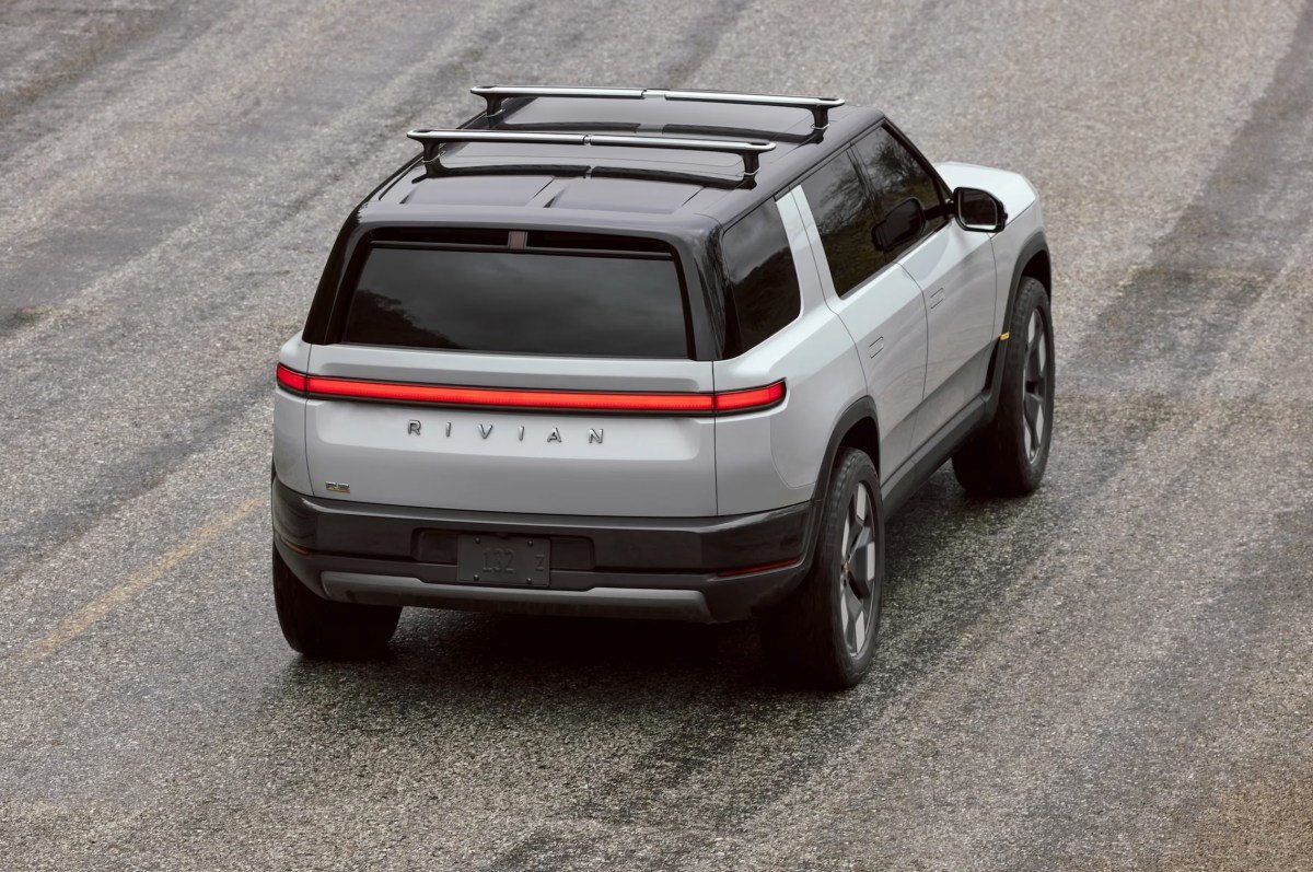 Rivian's Strategic Shift: Layoffs Coincide with R2 Deliveries and a Renewed Path to Profitability 3 Rivian R2 SUV on a delivery truck, symbolizing the company's dual challenges of market launch and workforce restructuring.
