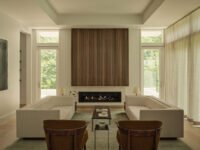 A beautifully designed living space by Sashya Thind, featuring a blend of global modernist furniture and warm textiles.