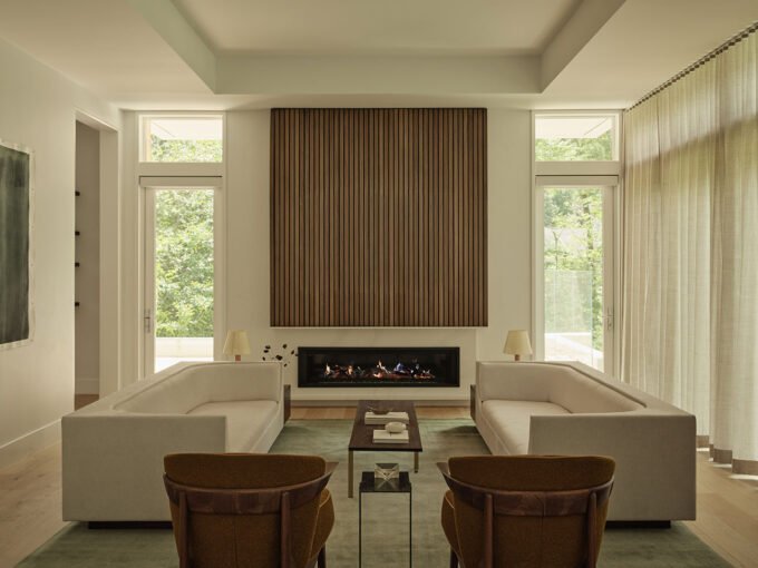 A beautifully designed living space by Sashya Thind, featuring a blend of global modernist furniture and warm textiles.