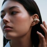 Sennheiser Accentum Clip open-ear earbuds, showcasing their unique clip-on design and sleek aesthetic.
