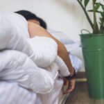 Illustration of a person sleeping peacefully, with subtle visual cues representing healthy breathing and a strong heart.