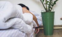 Illustration of a person sleeping peacefully, with subtle visual cues representing healthy breathing and a strong heart.