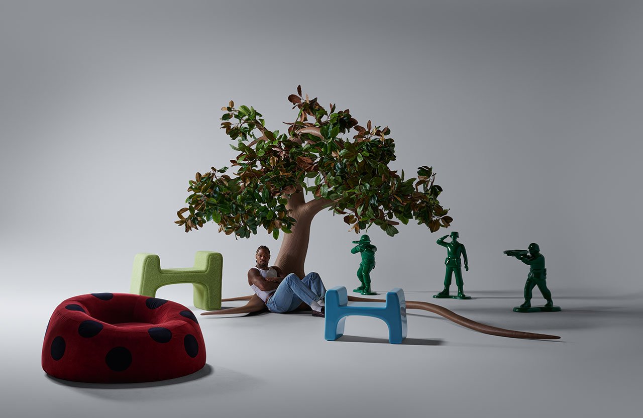 Stefon Diggs' 'If You Want Peace' exhibition at Tuleste Factory, featuring blue-hued furniture and surrealist art.