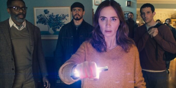 Steven Spielberg's 'Disclosure Day' movie poster featuring Emily Blunt, Josh O'Connor, and Colman Domingo, with a UFO in the background, alongside box office charts.
