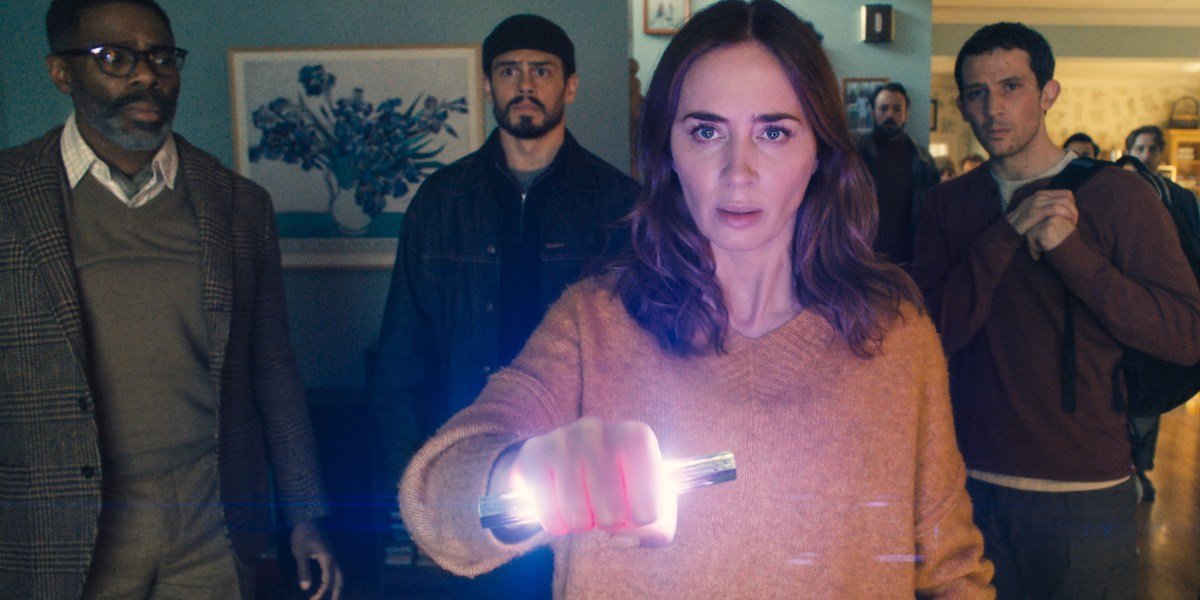 Steven Spielberg's 'Disclosure Day' movie poster featuring Emily Blunt, Josh O'Connor, and Colman Domingo, with a UFO in the background, alongside box office charts.