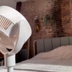 SwitchBot Standing Circulator Fan in a modern home setting, showcasing its adjustable height and sleek design.