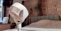 SwitchBot Standing Circulator Fan in a modern home setting, showcasing its adjustable height and sleek design.