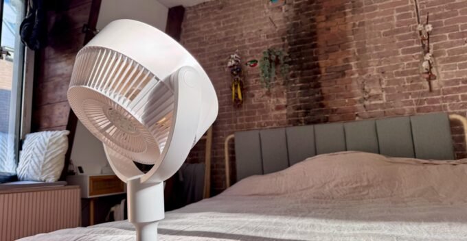 SwitchBot Standing Circulator Fan in a modern home setting, showcasing its adjustable height and sleek design.