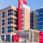 Bypass the Bots: Your Definitive Guide to Reaching a Live Human at Target Customer Service 2 A person speaking on the phone, with a Target logo subtly in the background, representing customer service interaction.