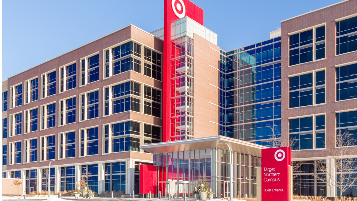 A person speaking on the phone, with a Target logo subtly in the background, representing customer service interaction.