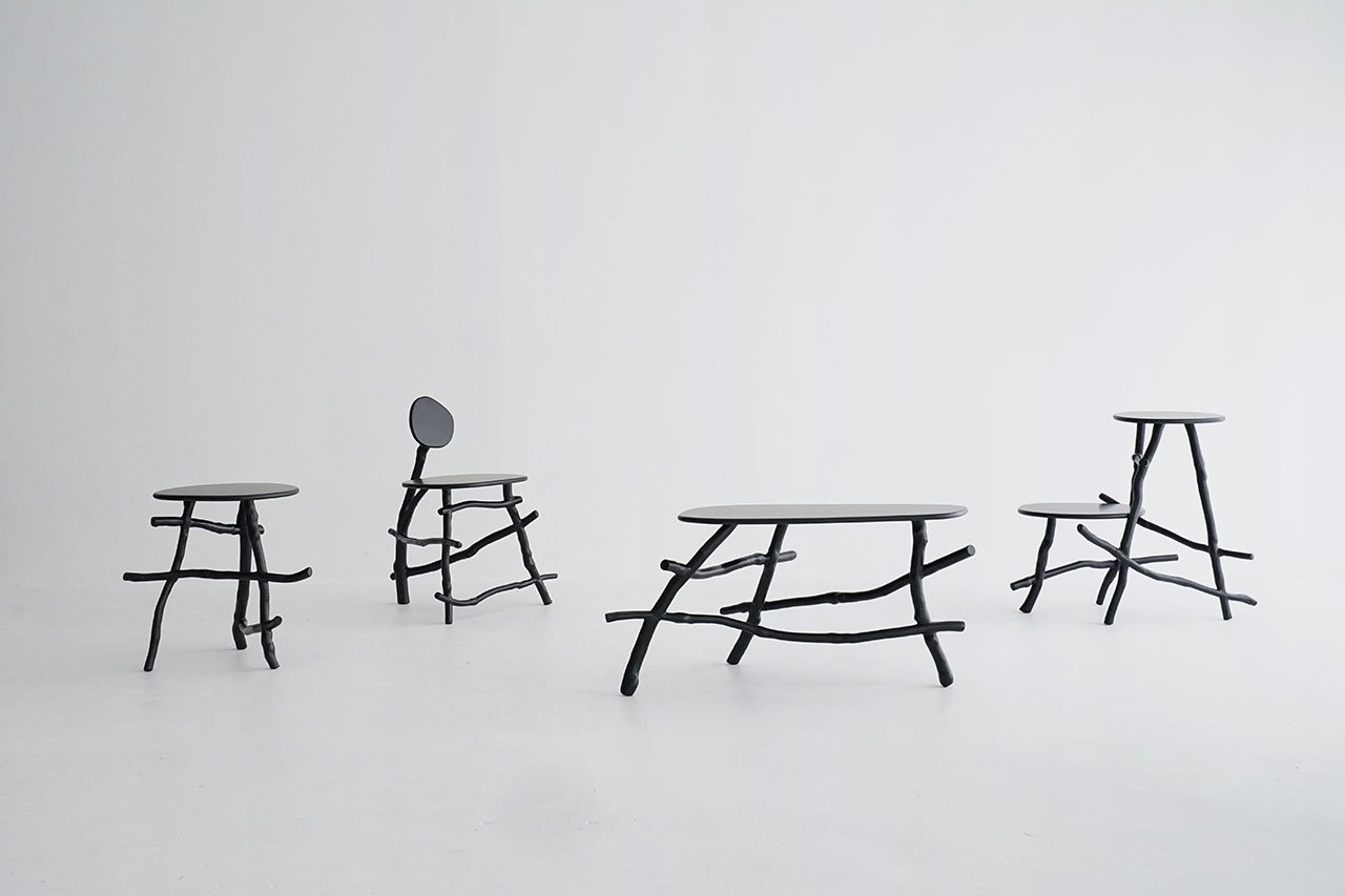Uneri by Sotanaka furniture collection, crafted from natural tree branches, showcasing organic design in a serene setting.