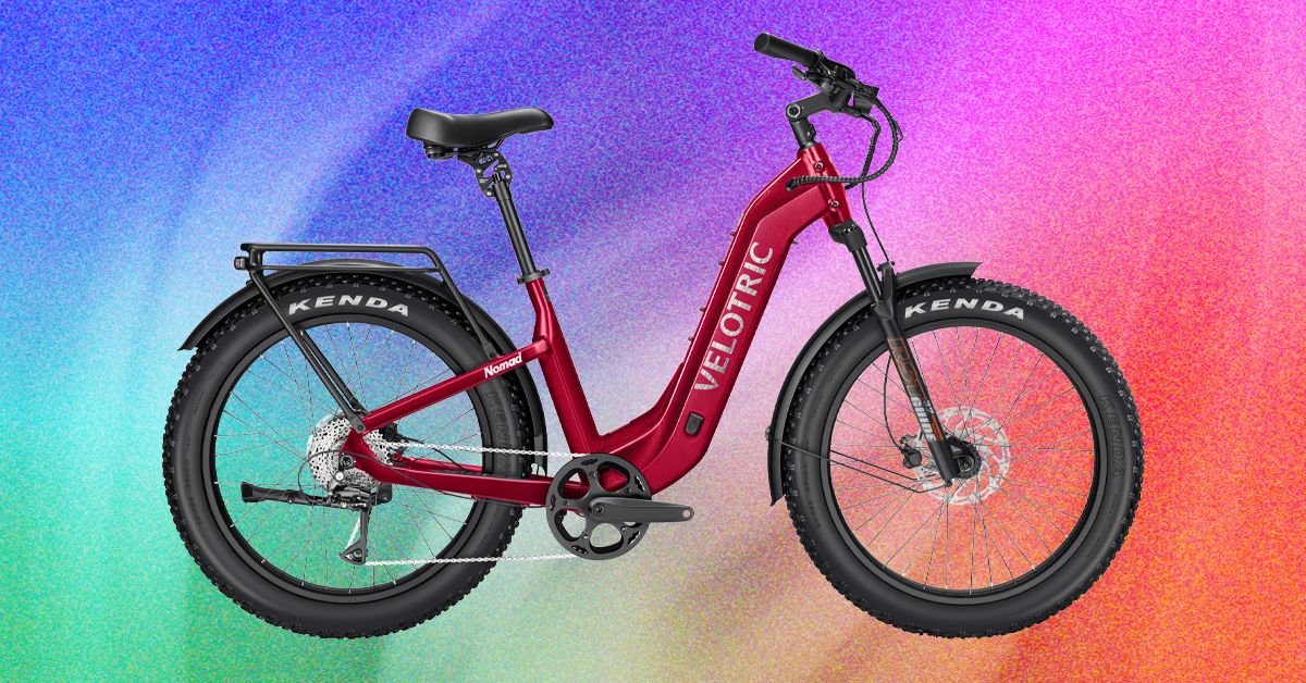 A Velotric Nomad 2 fat tire ebike parked on a scenic trail, highlighting its robust design and wide tires.