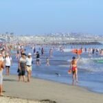 Scenic view of a pristine, affordable U.S. beach with clear water and white sand