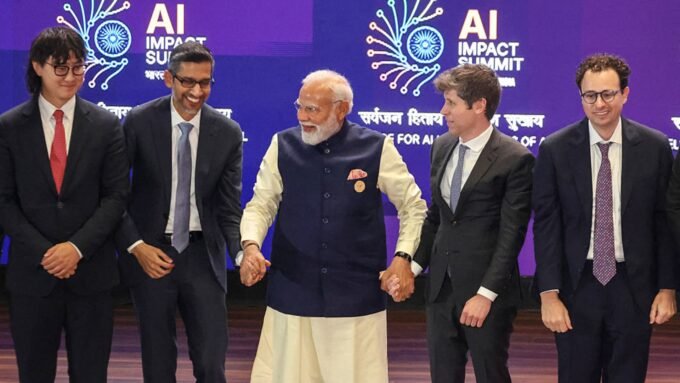 French President Emmanuel Macron and Indian Prime Minister Narendra Modi engaging with AI tech CEOs, symbolizing global efforts to attract AI investments.