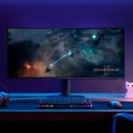 Alienware 34-inch curved ultrawide gaming monitor displaying a vibrant game scene.