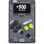 A close-up of the Arduboy FX-C credit card-sized game console displaying a pixelated game, highlighting its compact design and monochromatic screen.