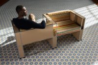 Armando Cabral's NKYINKYIM A CASA collection featuring a daybed and bookshelf with multi-directional striped fabrics.