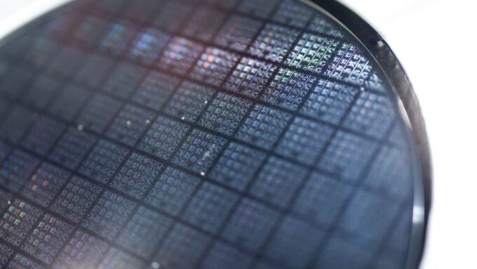 A semiconductor wafer on display, symbolizing the Asian tech industry's current market challenges.