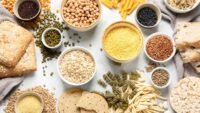 An athlete eating a carbohydrate-rich meal or snack, symbolizing energy and performance.
