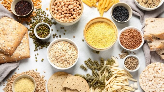 An athlete eating a carbohydrate-rich meal or snack, symbolizing energy and performance.