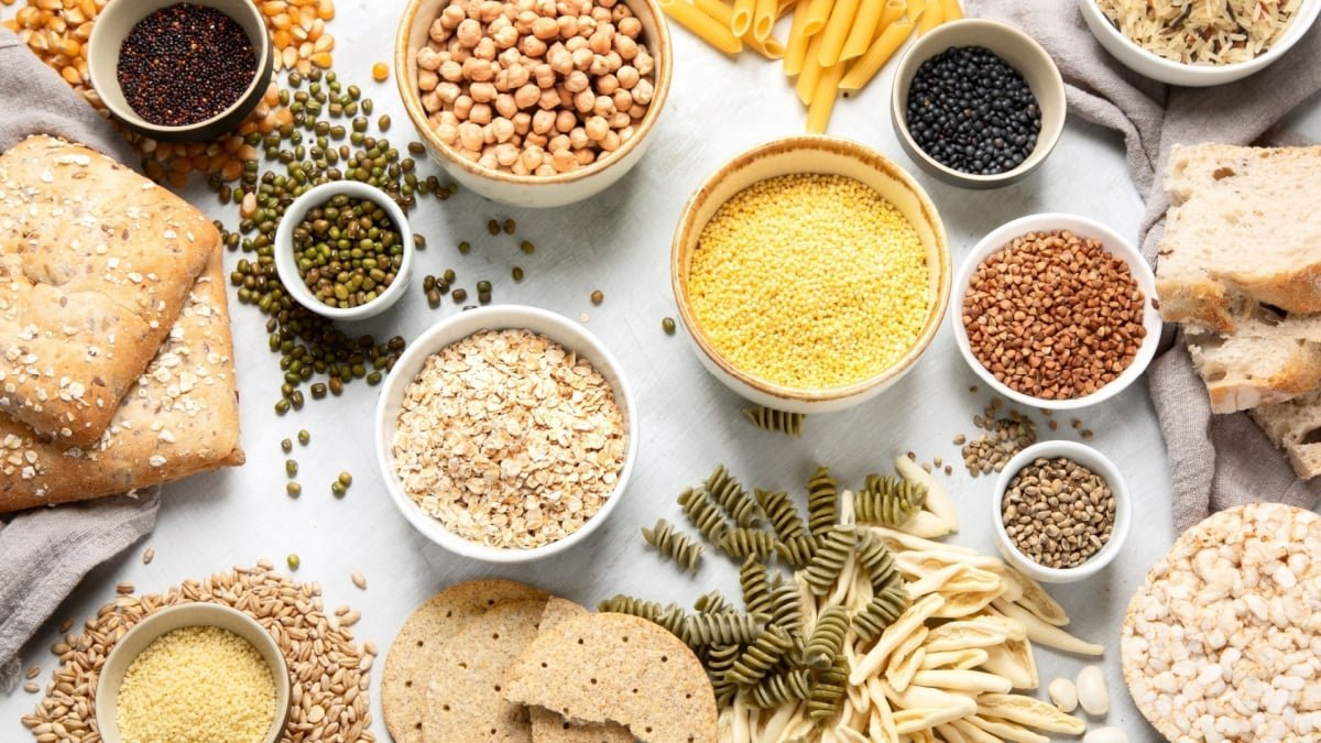 An athlete eating a carbohydrate-rich meal or snack, symbolizing energy and performance.