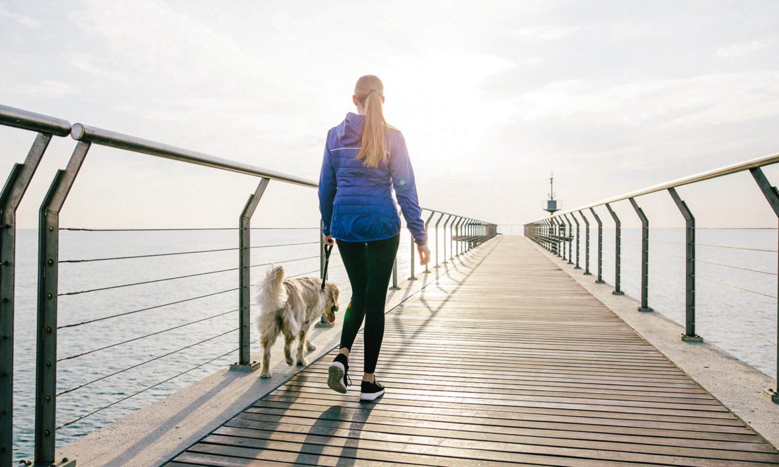An older adult enjoying a brisk walk outdoors, symbolizing active aging and cognitive health.