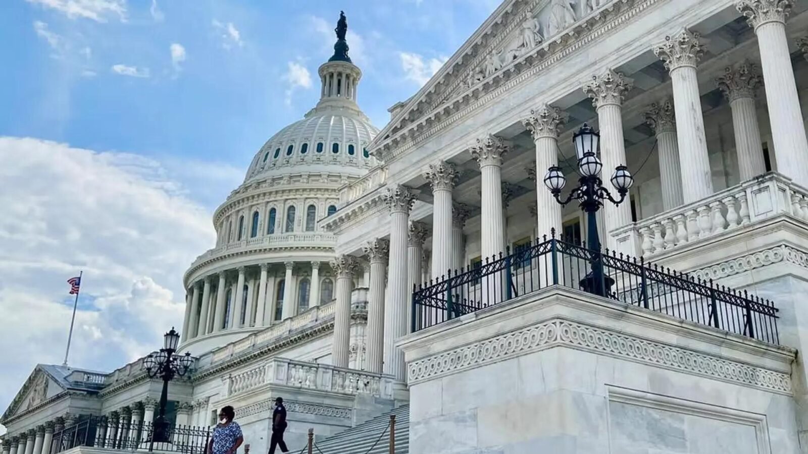 A gavel rests on a desk in front of a blurred image of the U.S. Capitol building, symbolizing legislative action and the delay of the Crypto Clarity Act.