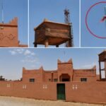 صورة لمستوصف زاوية سيدي صالح المهمل في زاكورة مع علم وطني متآكل