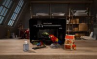 HeyGears G1X desktop full-color 3D and UV printer showcasing a vibrant, multi-textured 3D printed object.