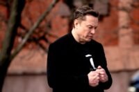Elon Musk looking serious, representing the legal scrutiny he faces.
