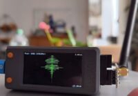 An ESP32 board connected to various components, demonstrating hardware debugging with the ESP32 Bit Pirate firmware.