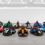 Formula 1 drivers in custom-built, drivable Lego minicars on the Silverstone track during the British Grand Prix Drivers' Parade.