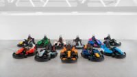 Formula 1 drivers in custom-built, drivable Lego minicars on the Silverstone track during the British Grand Prix Drivers' Parade.