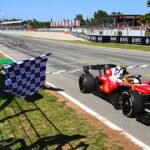 Formula 1 racing car speeding on a track, representing the excitement of the F1 season.